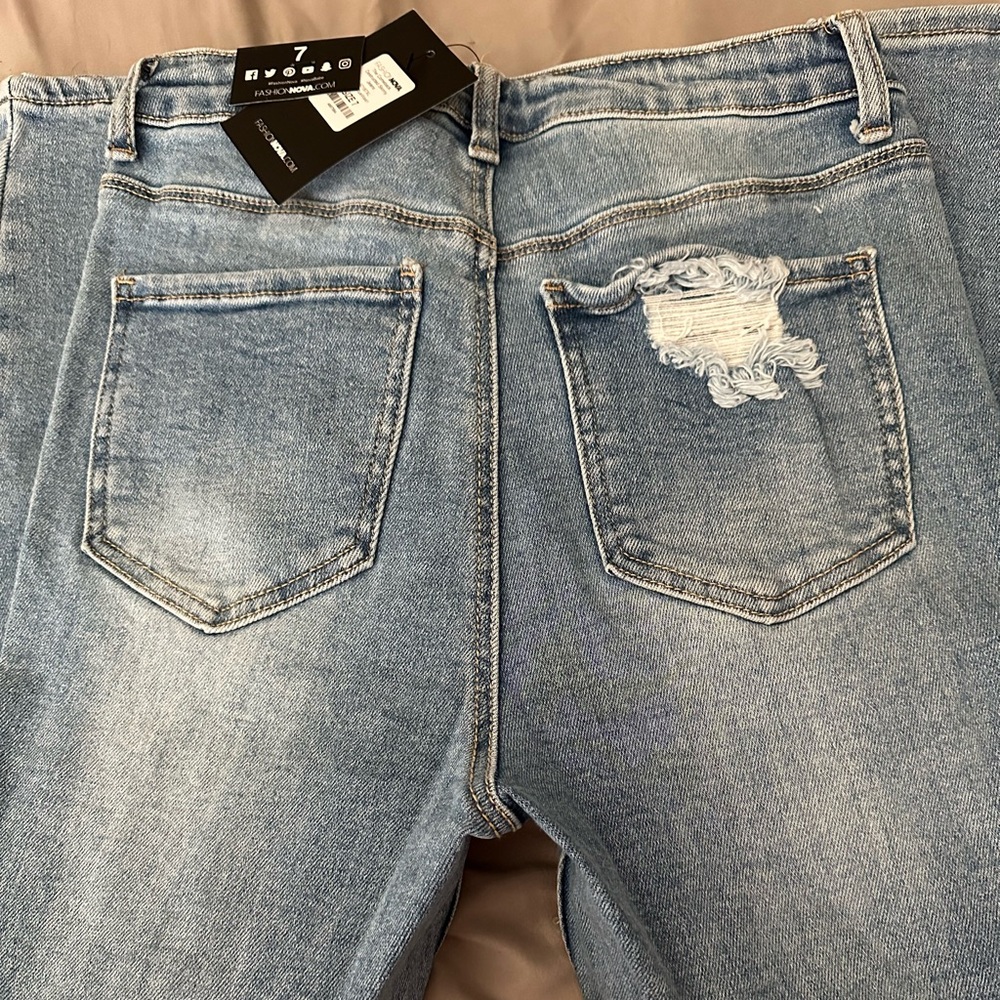 Fashion Nova skinny light blue wash.
